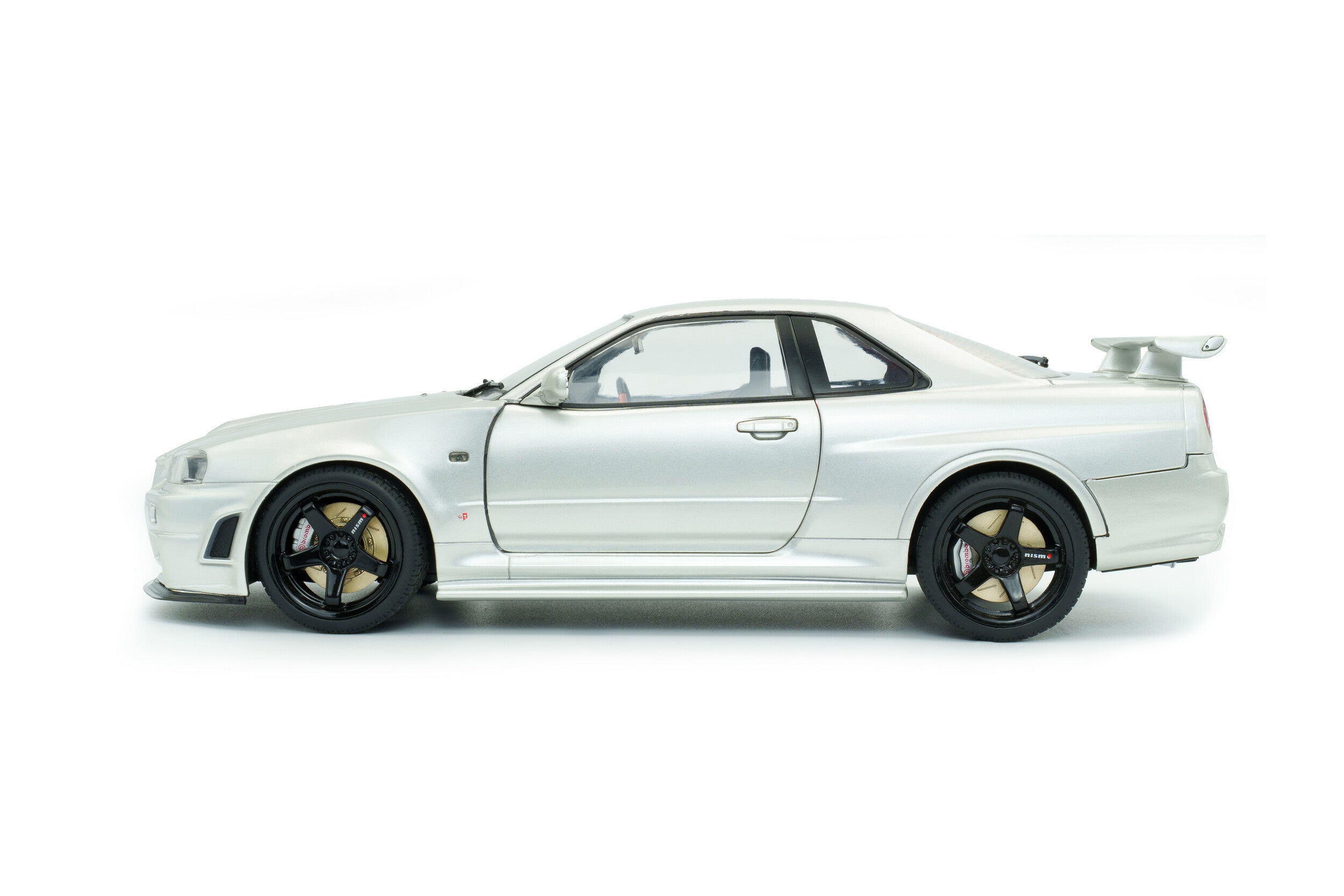 SOLIDO 1804312 MINIATURE NISSAN SKYLINE GT-R (BNR34) WITH NISMO PARTS SILVER 1999 1/18
